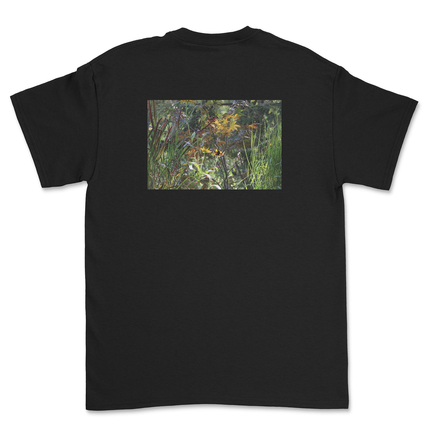 Black t-shirt with a nature-themed graphic on the back against a white background