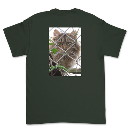 Black t-shirt with a cat behind a chain-link fence on the back