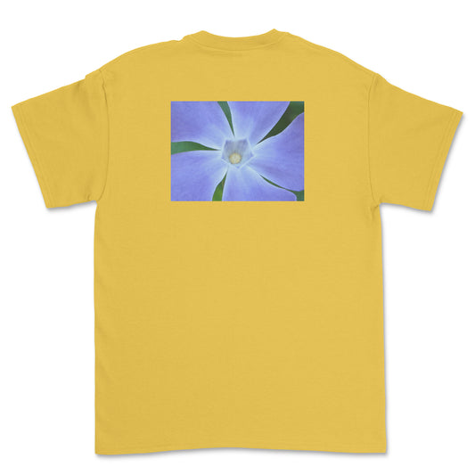Yellow t-shirt with a blue flower graphic on the back against a white background