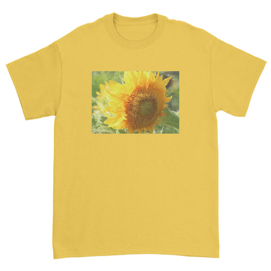 Yellow t-shirt with a sunflower graphic on a white background