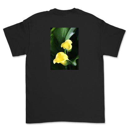 Black t-shirt with a graphic of two yellow flowers on a white background