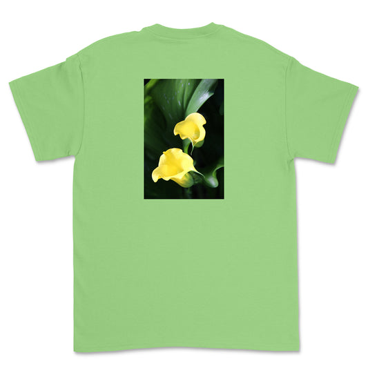 Green t-shirt with a graphic of two yellow flowers on a white background