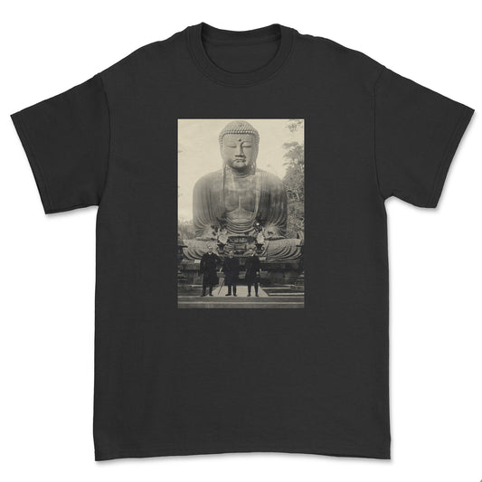 Black t-shirt with a graphic of a large Buddha statue and people in front on a white background